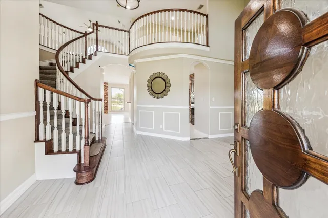 a kitchen with a sink a counter space appliances and cabinets