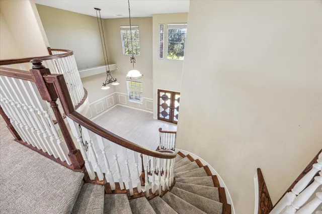 a kitchen with stainless steel appliances kitchen island granite countertop a stove and a refrigerator