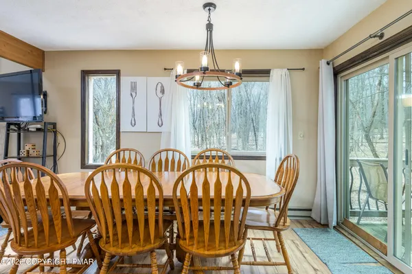 a view of a dining room with furniture window and outside view