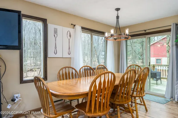 a view of a dining room with furniture window and outside view