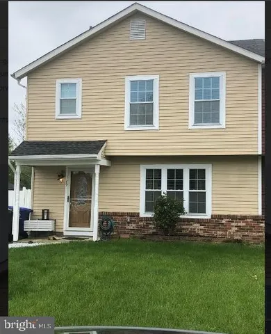 a kitchen with a refrigerator and a sink