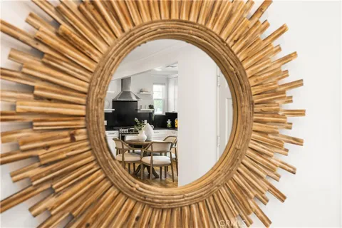a view of a balcony with furniture and wooden floor