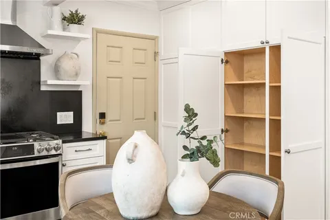 a living room with furniture a rug and a window