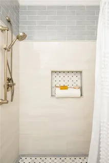 a picture of a bathroom with a shower