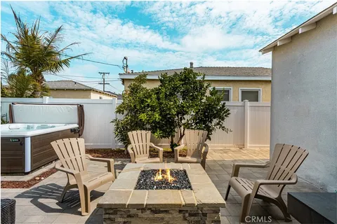 a view of a patio with table and chairs and potted plants