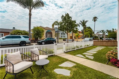a view of a chair and tables in the patio