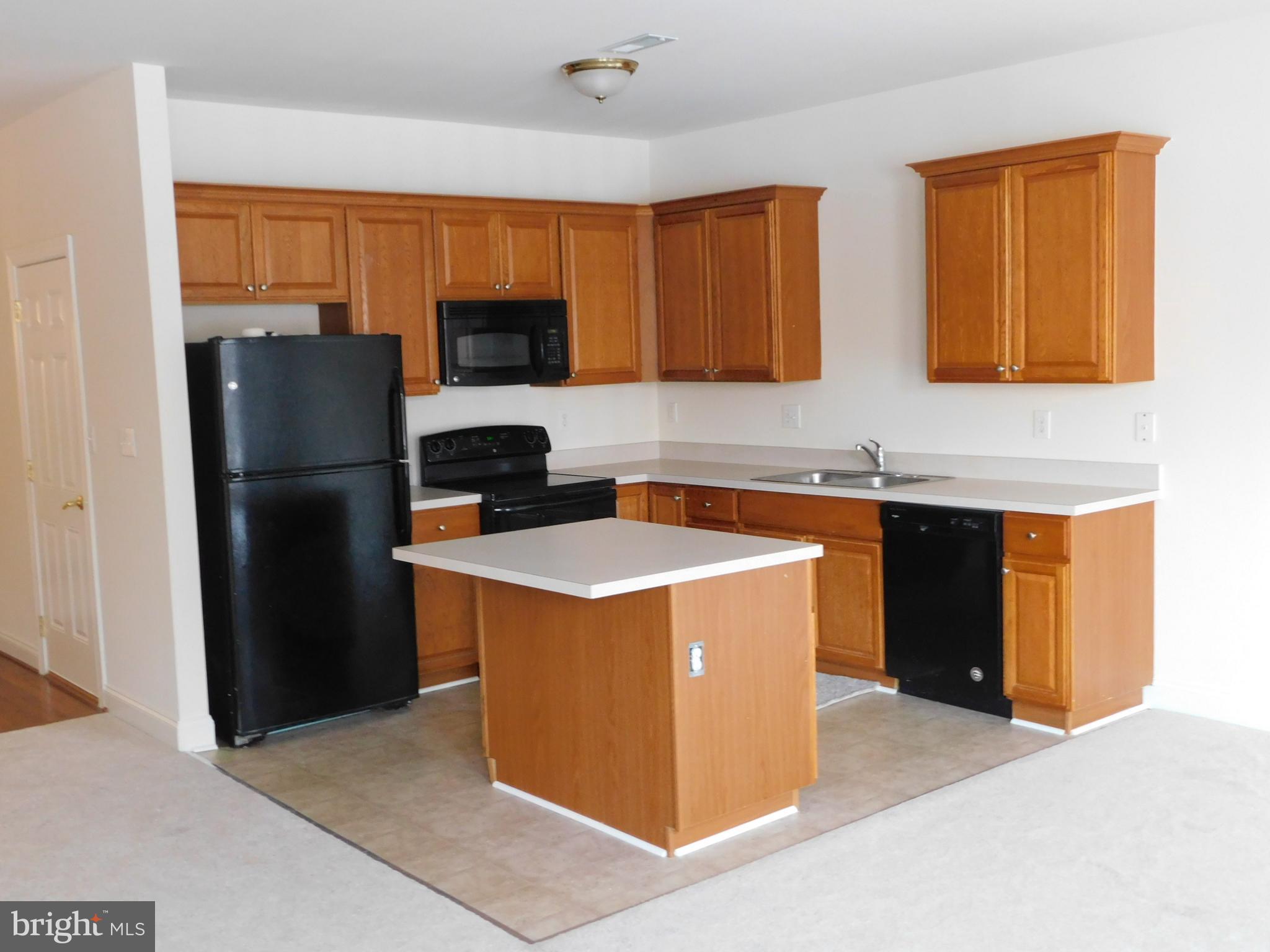 70 Sugar Maple Road Barto, PA 19504 - Photo 2 of 14 a kitchen with stainless steel appliances granite countertop a refrigerator stove and sink