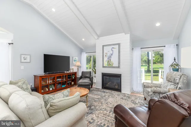 a room with furniture and a flat screen tv