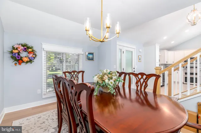 a kitchen with granite countertop cabinets a sink a window and stainless steel appliances
