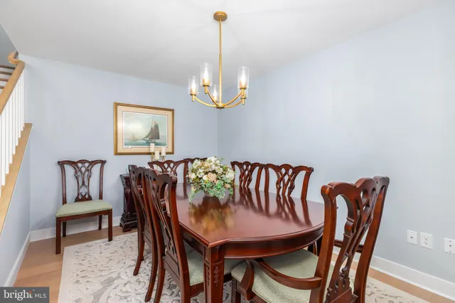 a large kitchen with stainless steel appliances granite countertop a stove a sink dishwasher and a refrigerator