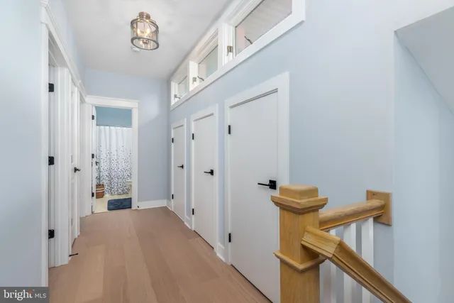 a bathroom with a sink toilet and a mirror