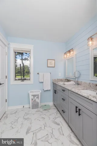 a bedroom with bed and window