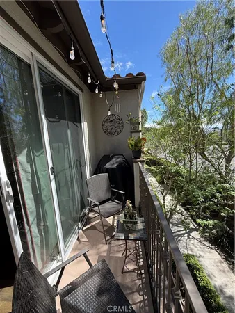 a view of a balcony with chairs