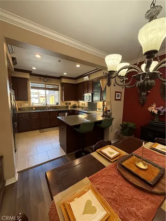 a kitchen with counter top space appliances and cabinets