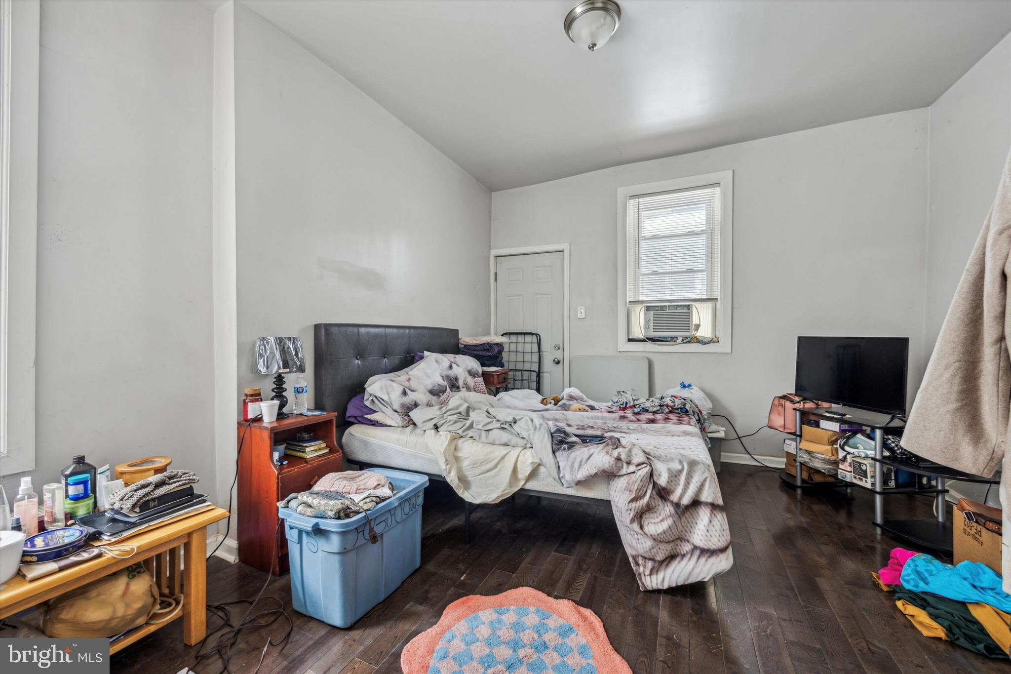 5739 Springfield Avenue Philadelphia, PA 19143 - Photo 12 of 16 a bed room with bed and a tv