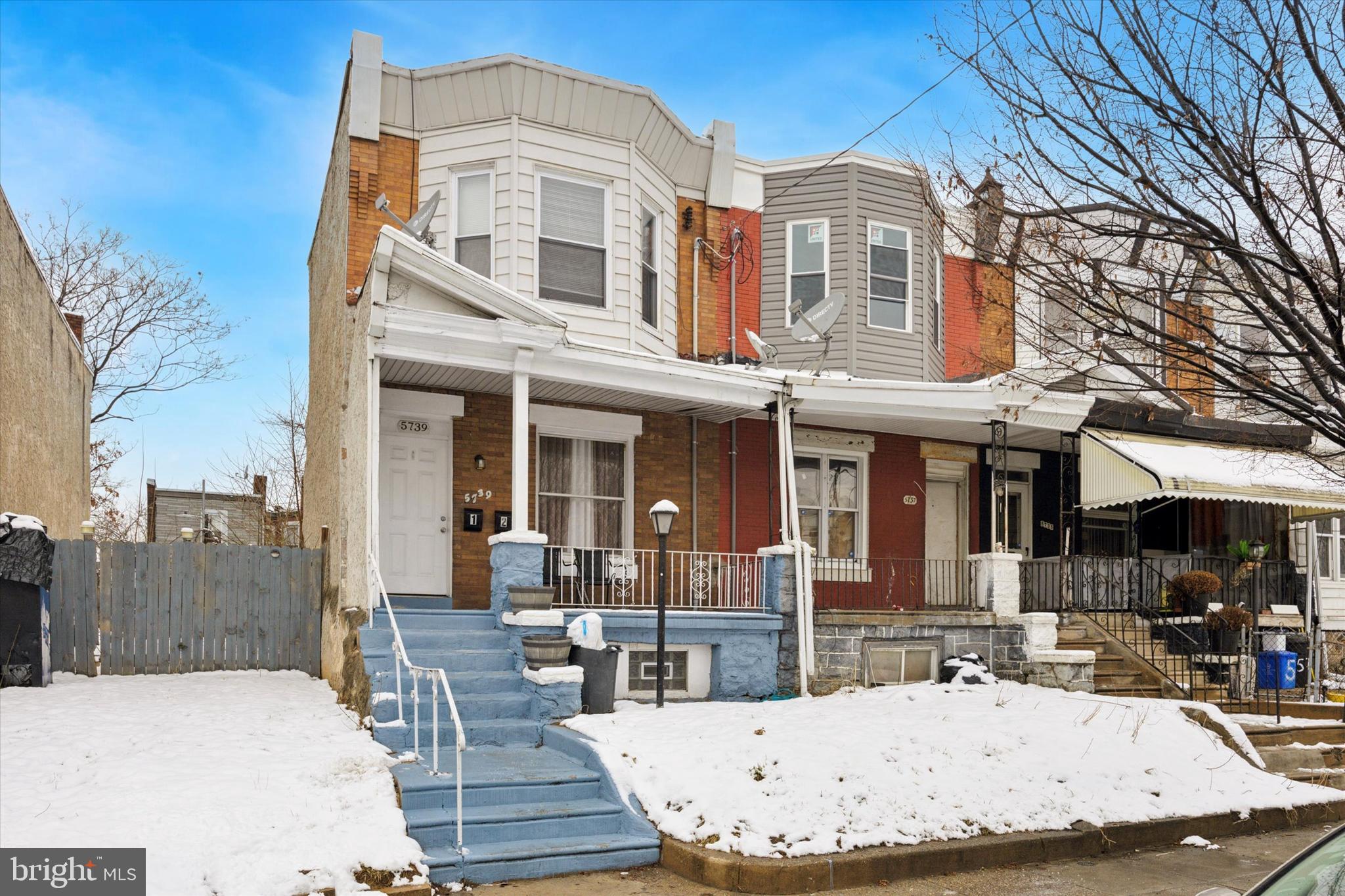 5739 Springfield Avenue Philadelphia, PA 19143 - Photo 16 of 16 a view of a building with a table and chairs