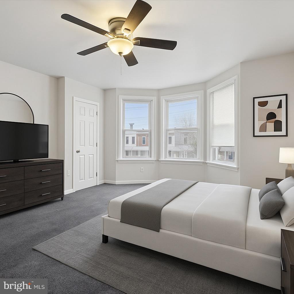 5739 Springfield Avenue Philadelphia, PA 19143 - Photo 4 of 16 a bedroom with a bed and a flat screen tv