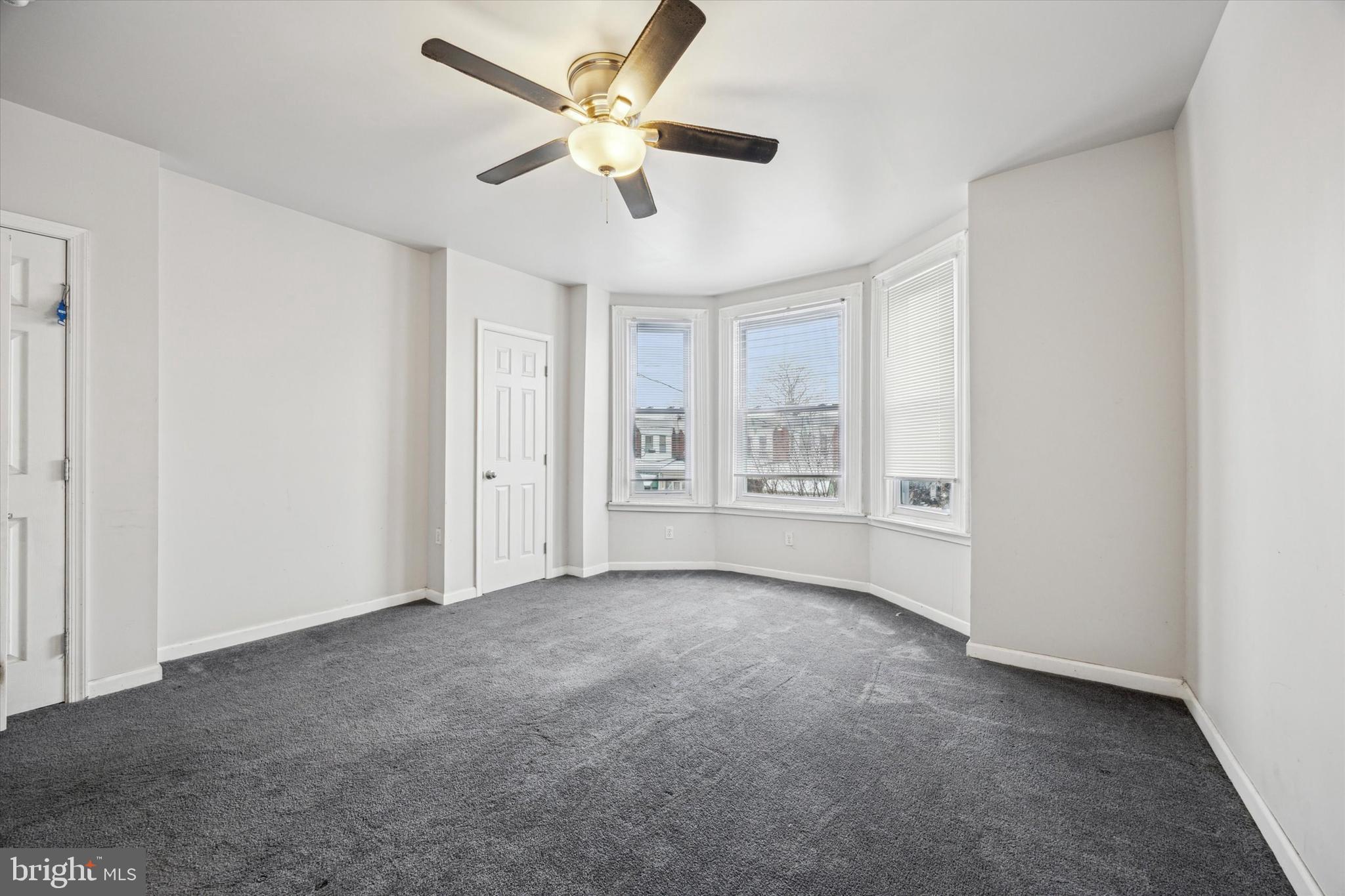 5739 Springfield Avenue Philadelphia, PA 19143 - Photo 5 of 16 a view of an empty room with a window