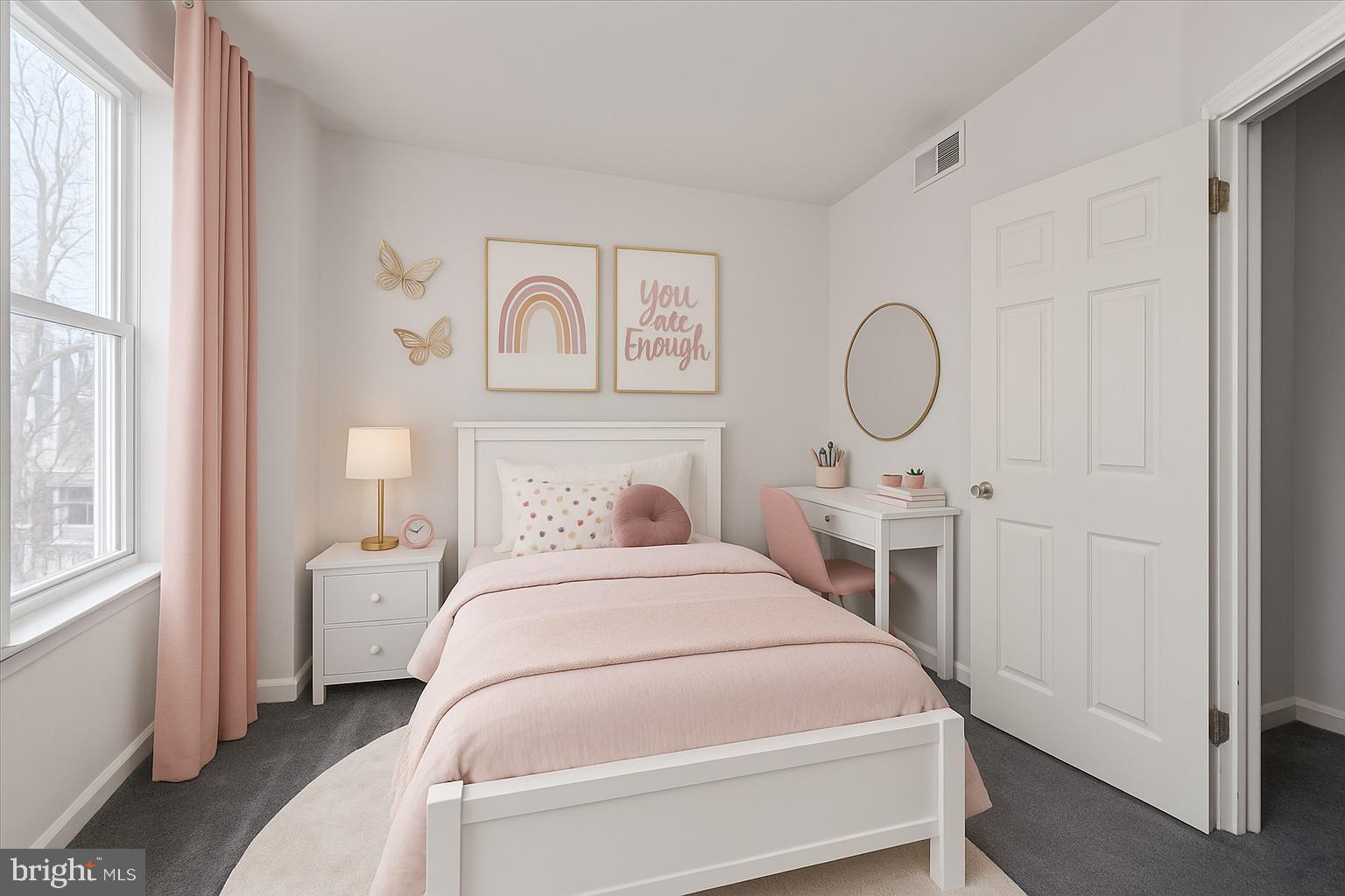 5739 Springfield Avenue Philadelphia, PA 19143 - Photo 7 of 16 a bedroom with a bed a mirror and a window