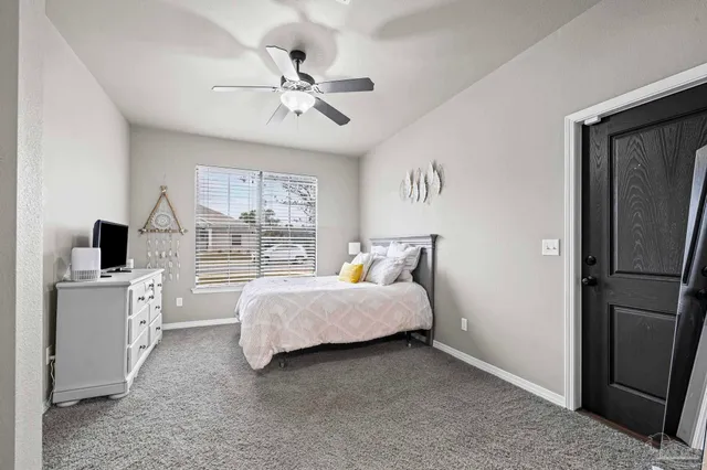 a kitchen with granite countertop white cabinets white stainless steel appliances and sink