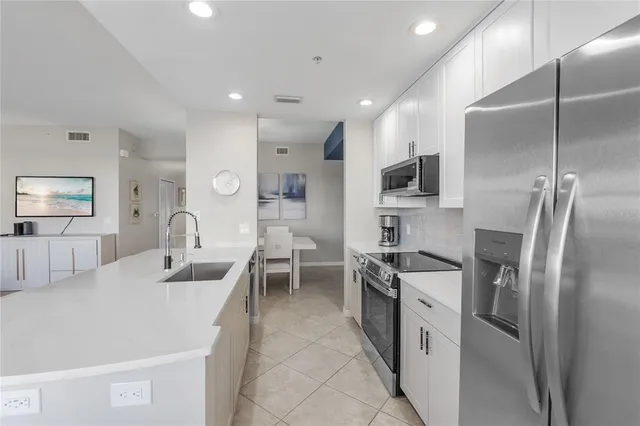 a kitchen with counter top space cabinets and stainless steel appliances