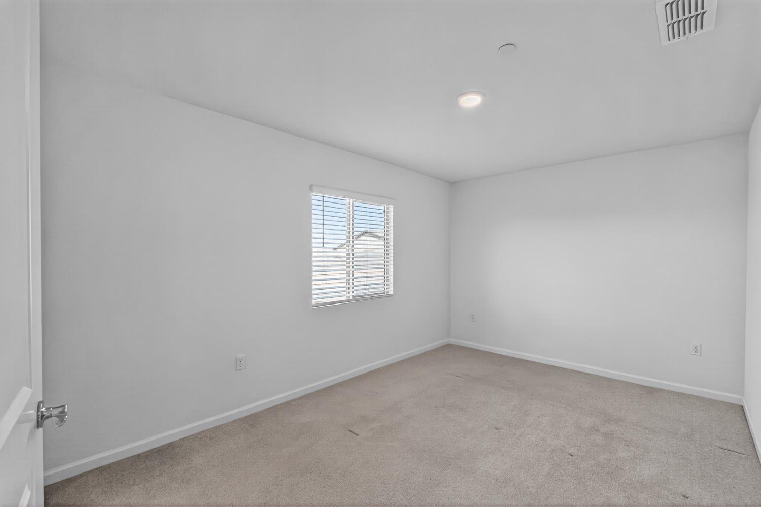 12829 Scholarly Way Rancho Cordova, CA 95742 - Photo 12 of 33 an empty room with a window