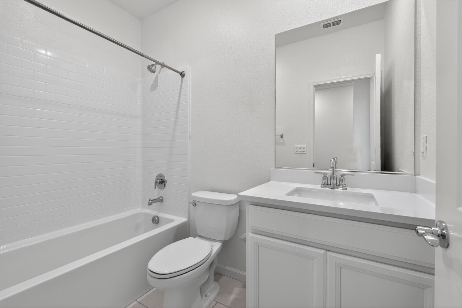 12829 Scholarly Way Rancho Cordova, CA 95742 - Photo 27 of 33 a bathroom with a sink a toilet and a mirror