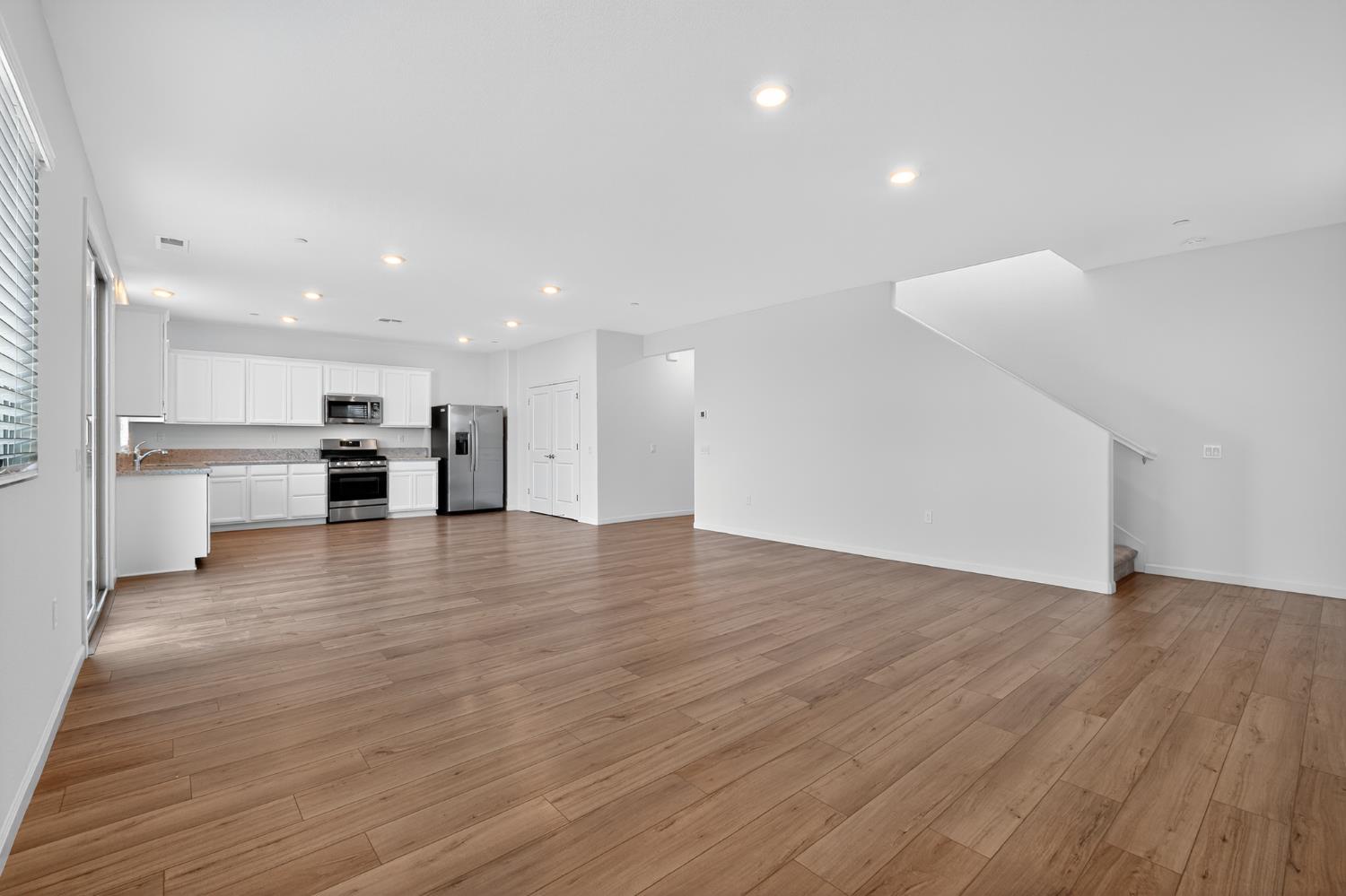 12829 Scholarly Way Rancho Cordova, CA 95742 - Photo 3 of 33 a view of a kitchen with a sink and a stove top oven