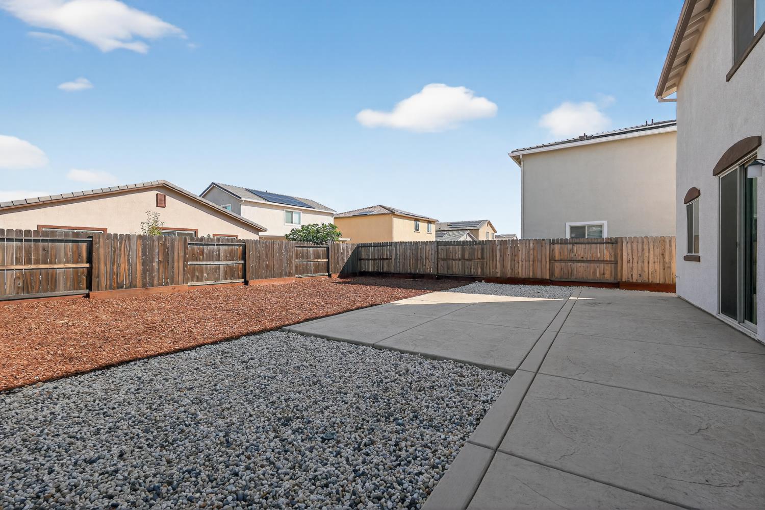 12829 Scholarly Way Rancho Cordova, CA 95742 - Photo 32 of 33 a view of a house with a backyard