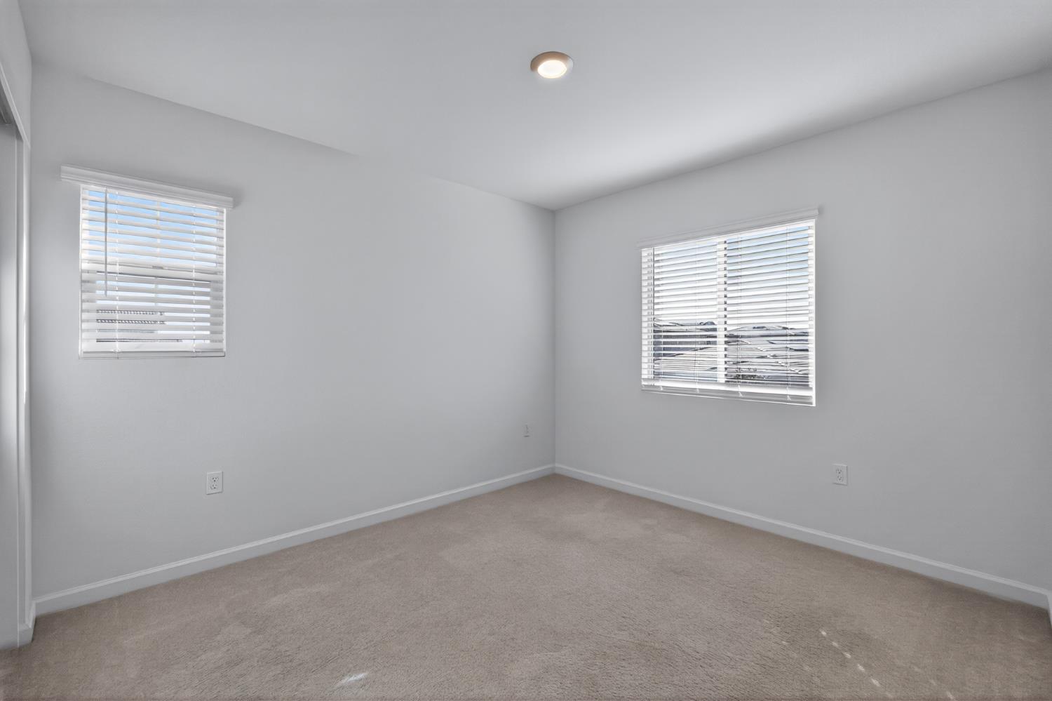 12829 Scholarly Way Rancho Cordova, CA 95742 - Photo 4 of 33 an empty room with windows