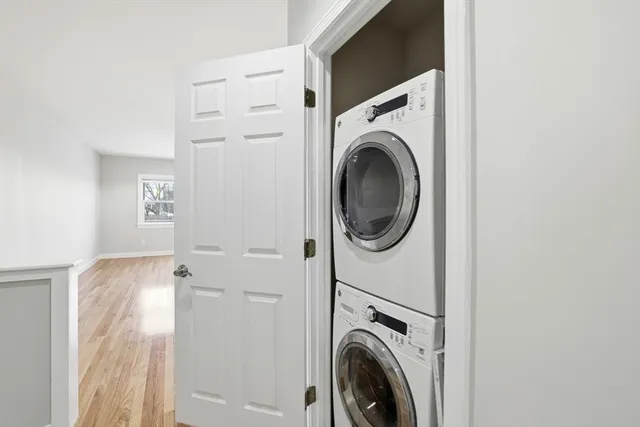 a view of a hallway with washer and dryer