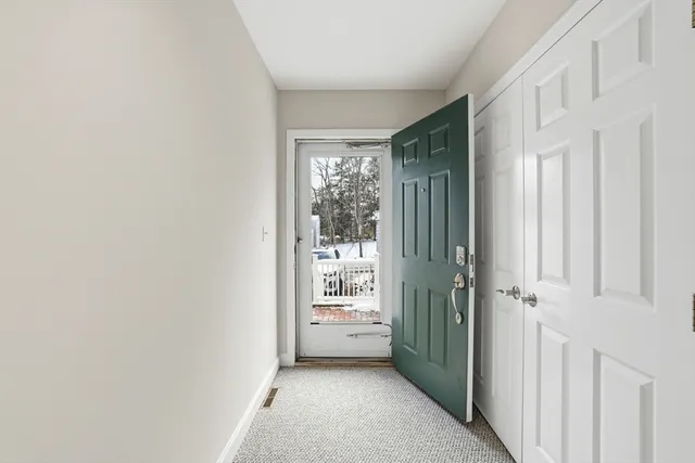 a view of a hallway with windows