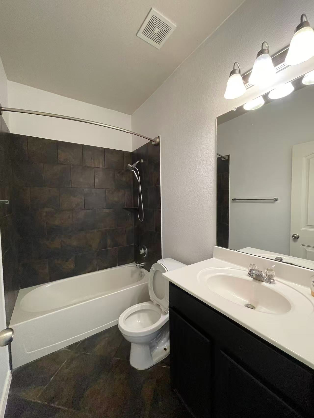 457 Dragon Ridge Road Buda, TX 78610 - Photo 13 of 29 Full bath featuring vanity, shower / washtub combination, and a textured wall