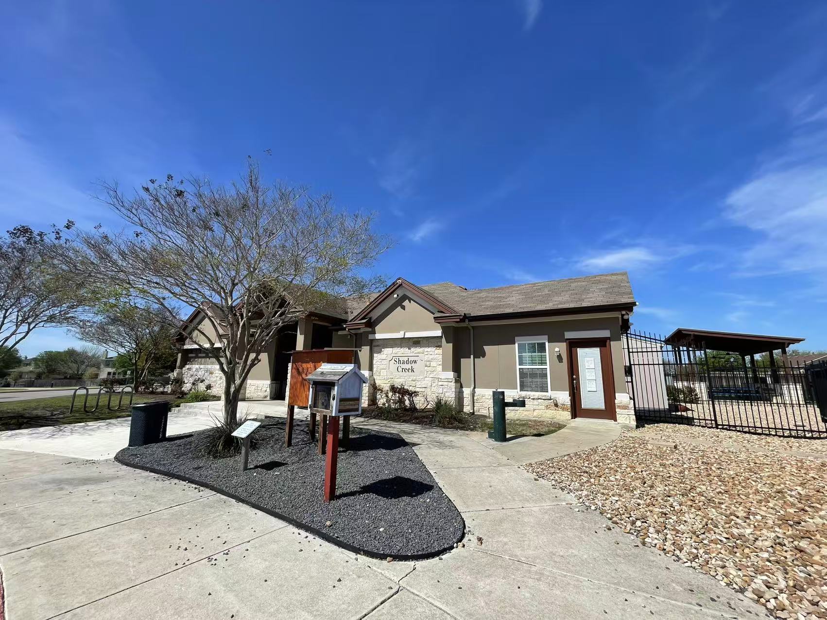 457 Dragon Ridge Road Buda, TX 78610 - Photo 22 of 29 View of front facade with stone siding and stucco siding