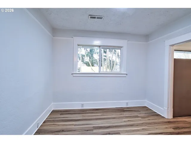a view of wooden floor in an empty room