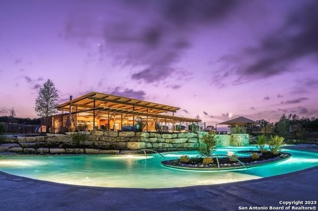 5386 Ranch Road 1376 Fredericksburg, TX 78624 - Photo 1 of 30 a view of a big building with swimming pool and a yard