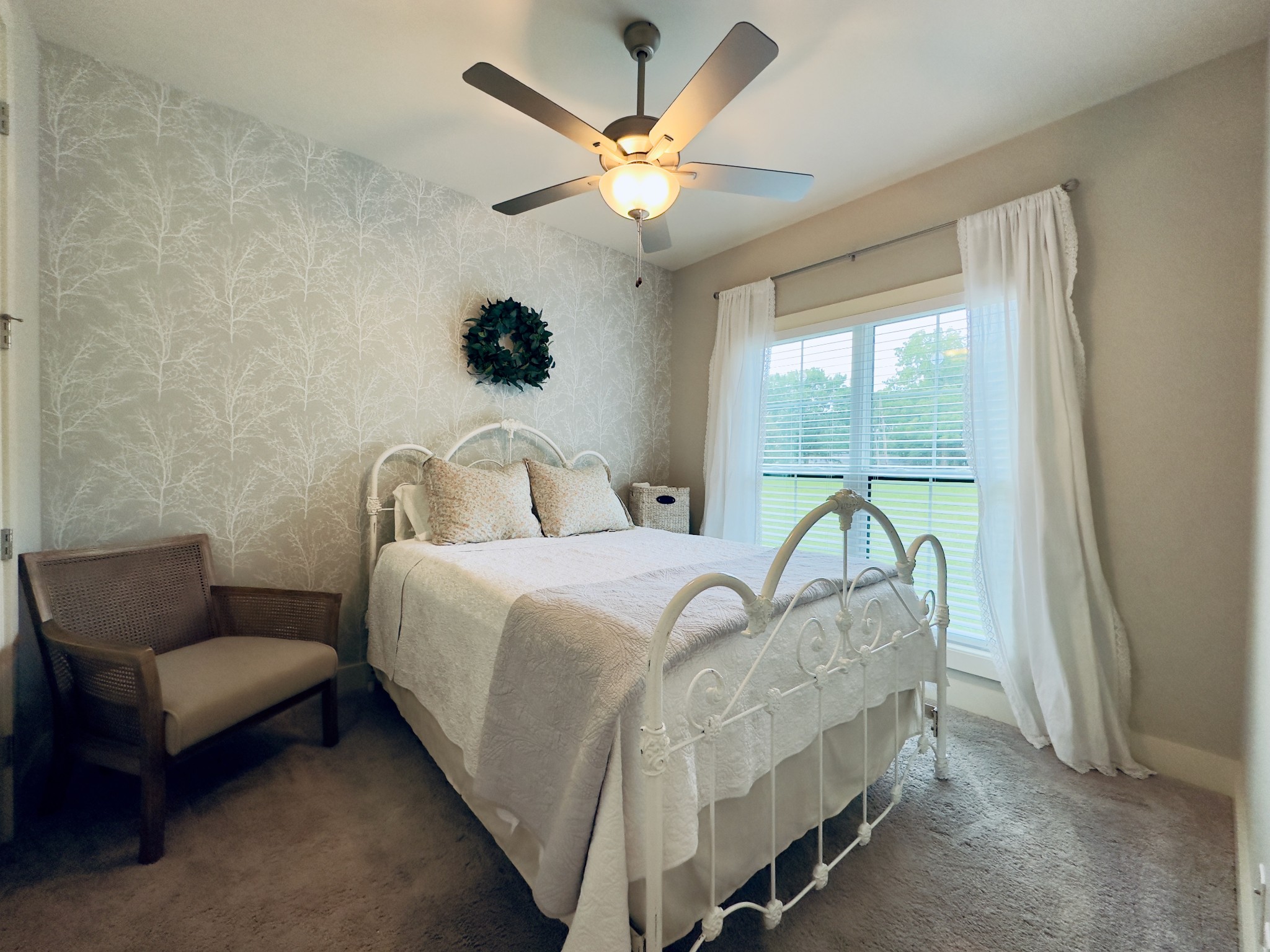 488 Cole's Ferry Road Gallatin, TN 37066 - Photo 22 of 43 a bedroom with a bed a couch and a window