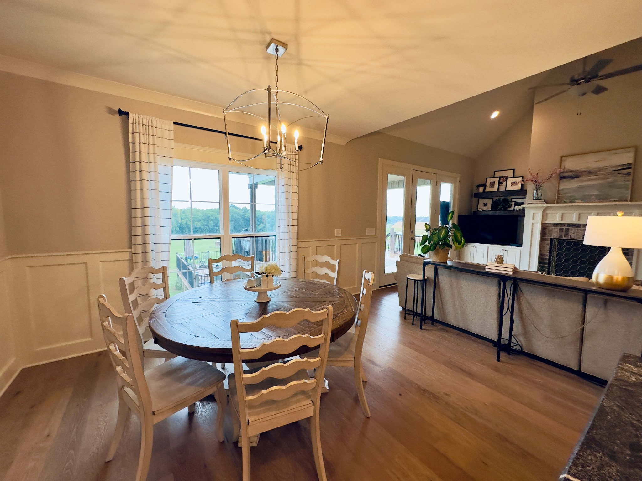 488 Cole's Ferry Road Gallatin, TN 37066 - Photo 31 of 43 a dining room with furniture a chandelier and wooden floor