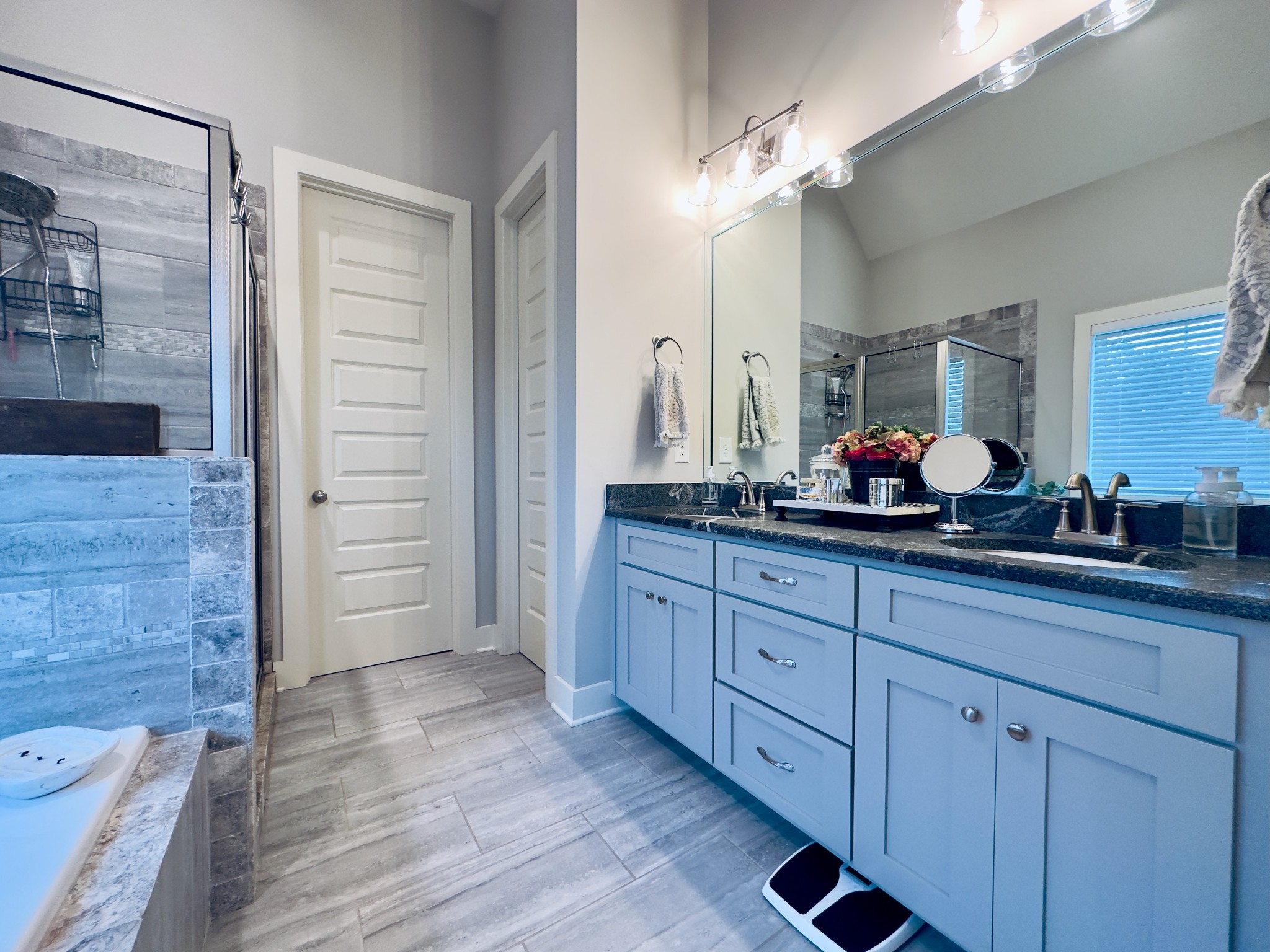 488 Cole's Ferry Road Gallatin, TN 37066 - Photo 36 of 43 a spacious bathroom with double vanity a mirror and a shower