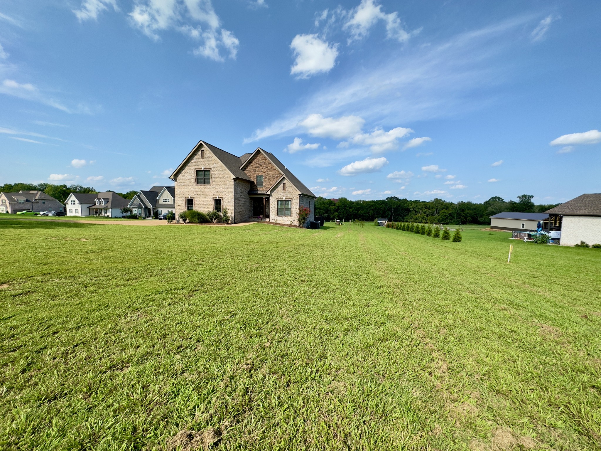 488 Cole's Ferry Road Gallatin, TN 37066 - Photo 5 of 43 a front view of a house with a yard and lake view