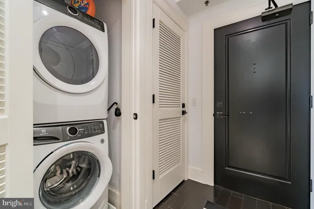 a bedroom with a bed and a night stand