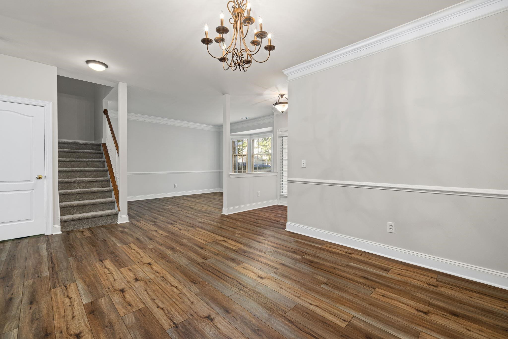 9510 Lost Key Court Raleigh, NC 27617 - Photo 13 of 46 wooden floor in an empty room with a window