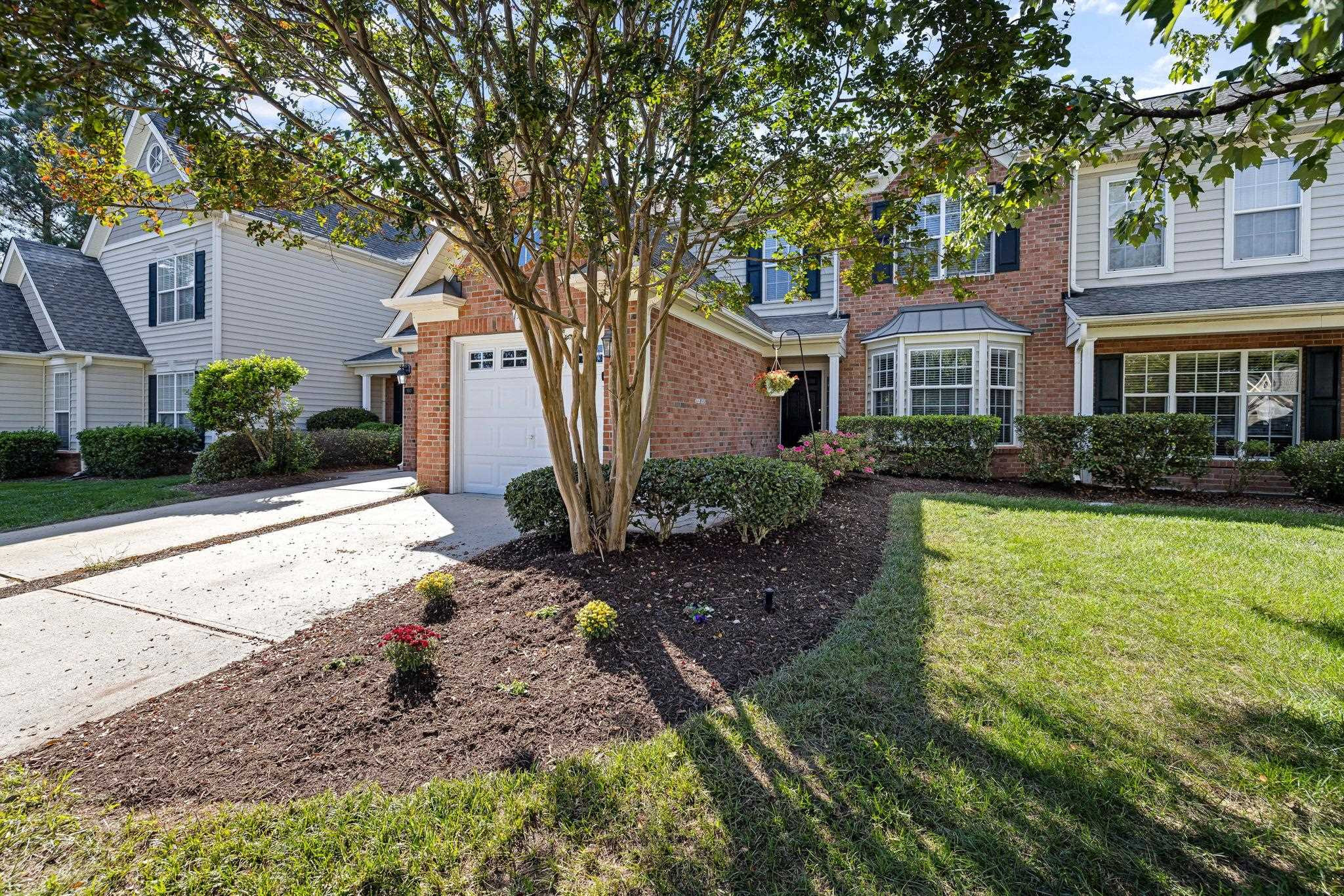 9510 Lost Key Court Raleigh, NC 27617 - Photo 2 of 46 a front view of a house with garden