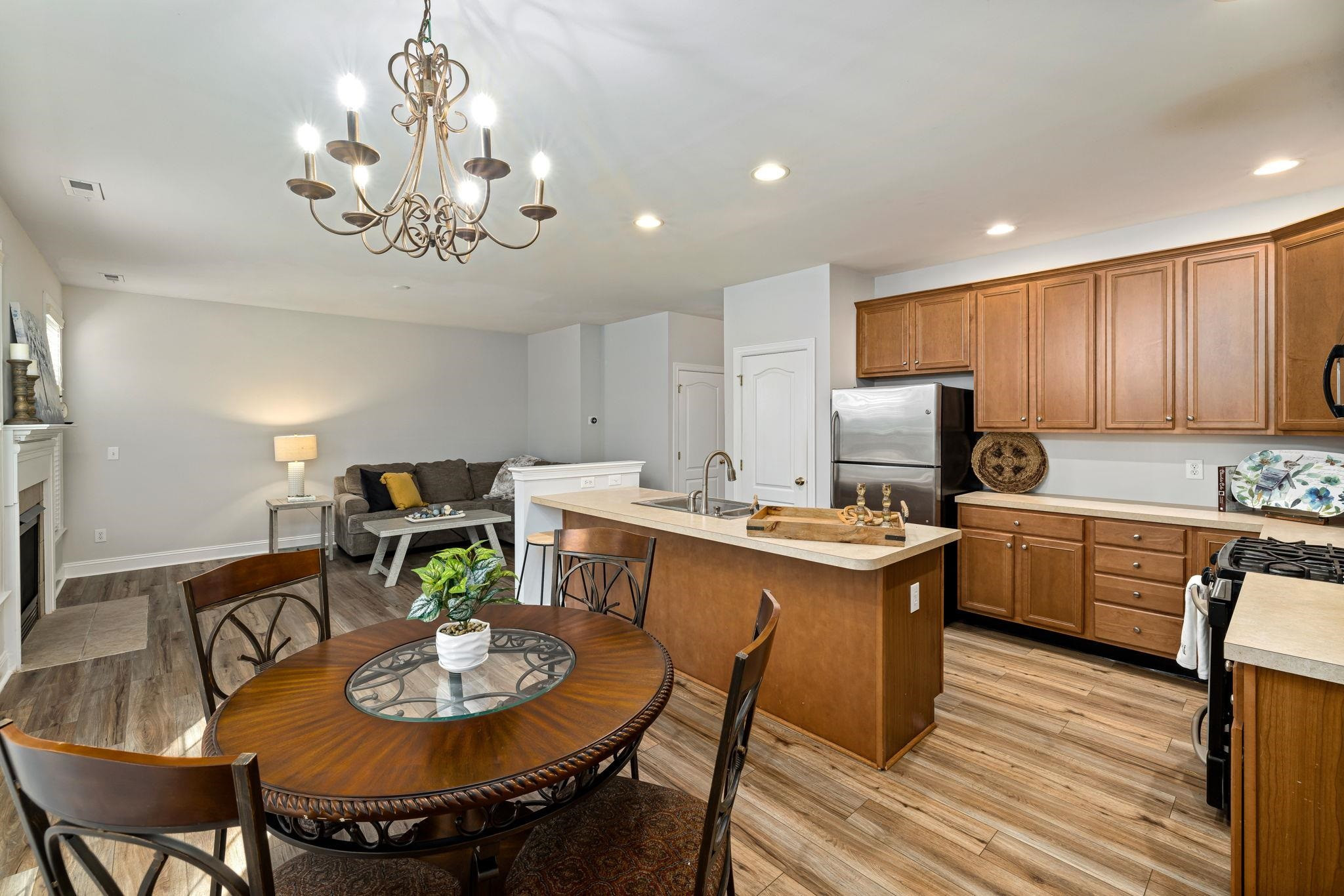 9510 Lost Key Court Raleigh, NC 27617 - Photo 21 of 46 a kitchen with a dining table and chairs