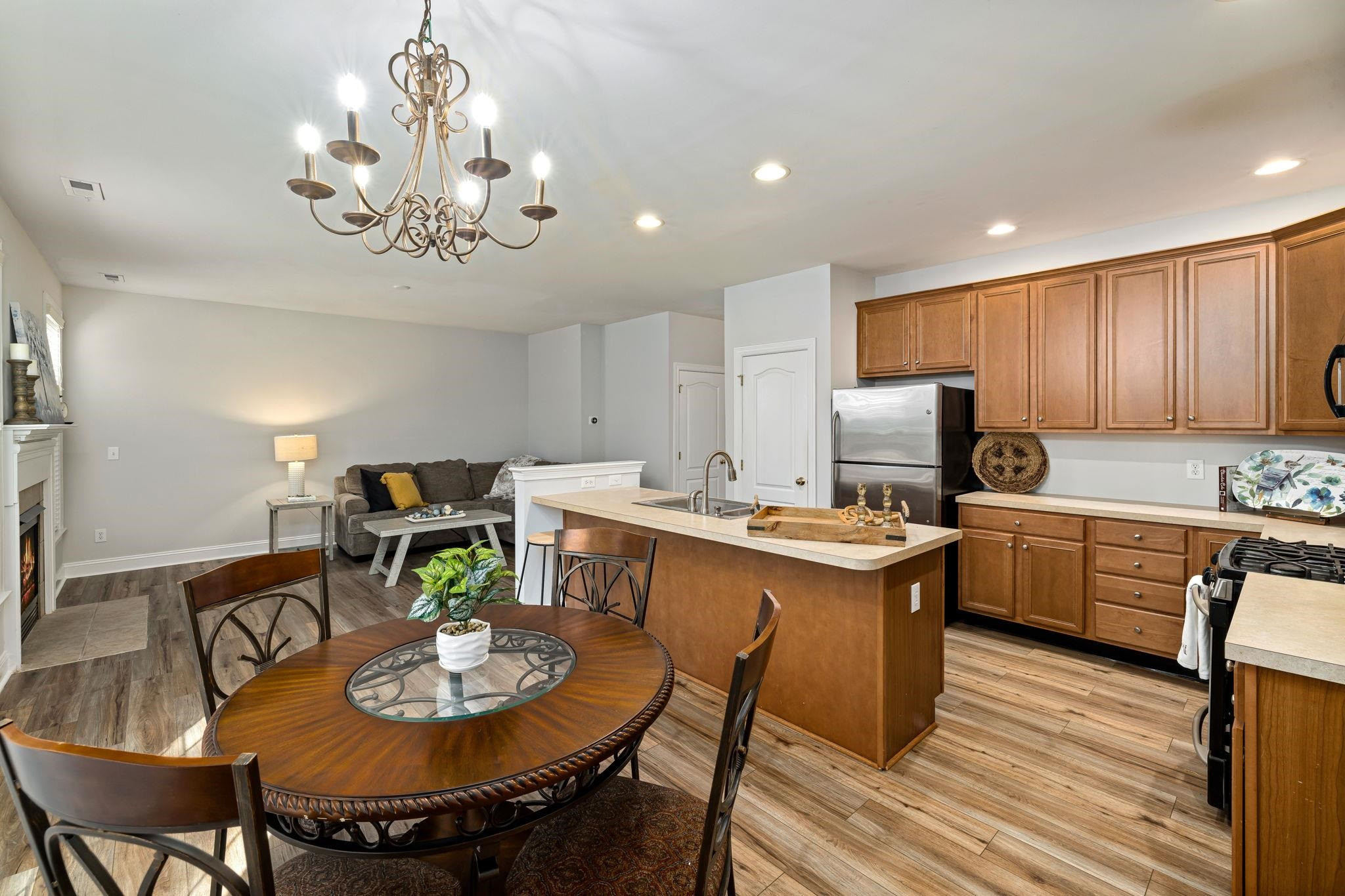 9510 Lost Key Court Raleigh, NC 27617 - Photo 22 of 46 a kitchen with a dining table and chairs