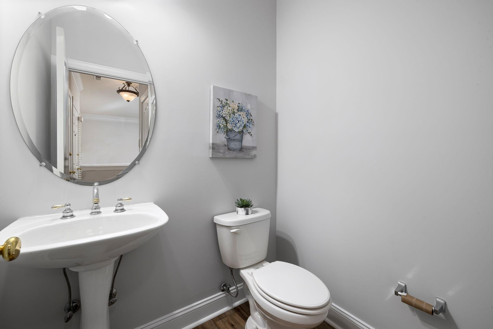 9510 Lost Key Court Raleigh, NC 27617 - Photo 23 of 46 a bathroom with a toilet a sink and mirror