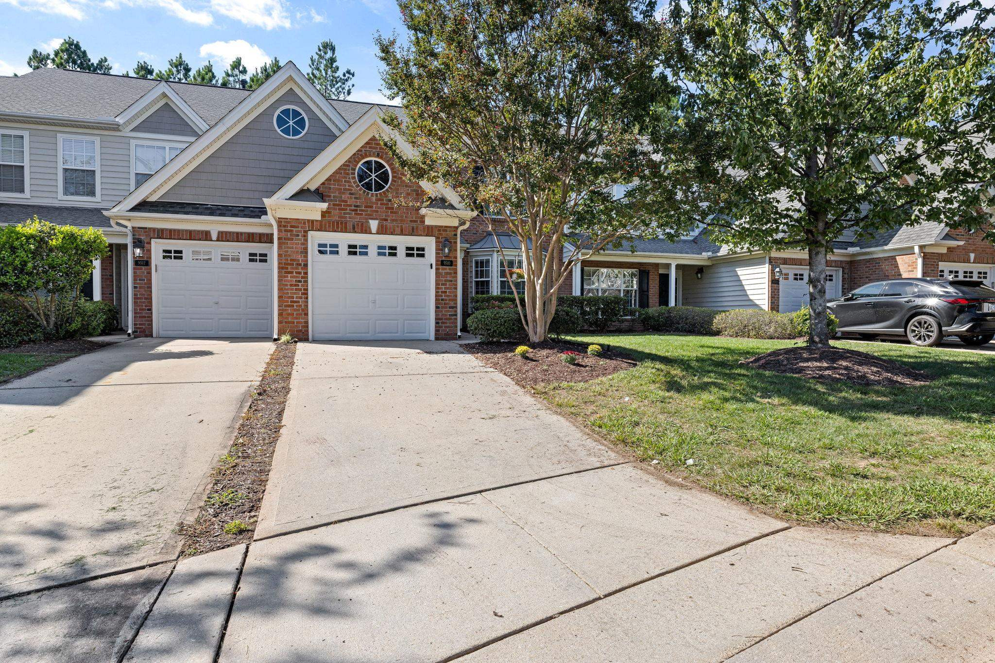 9510 Lost Key Court Raleigh, NC 27617 - Photo 3 of 46 a front view of a house with garden
