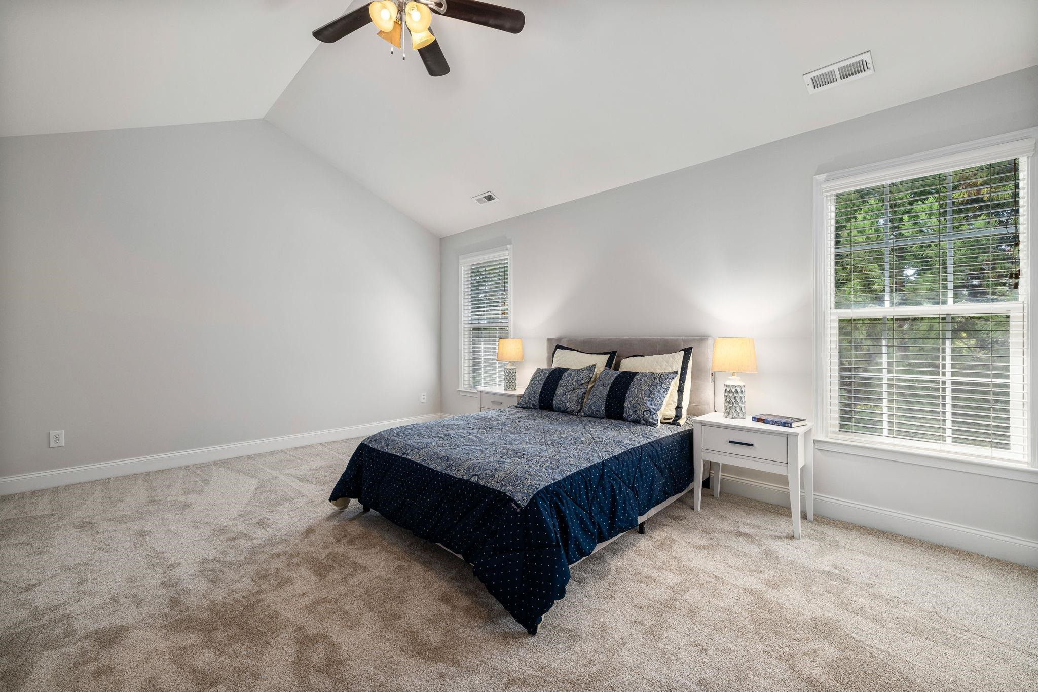 9510 Lost Key Court Raleigh, NC 27617 - Photo 31 of 46 a bedroom with a bed and a large window