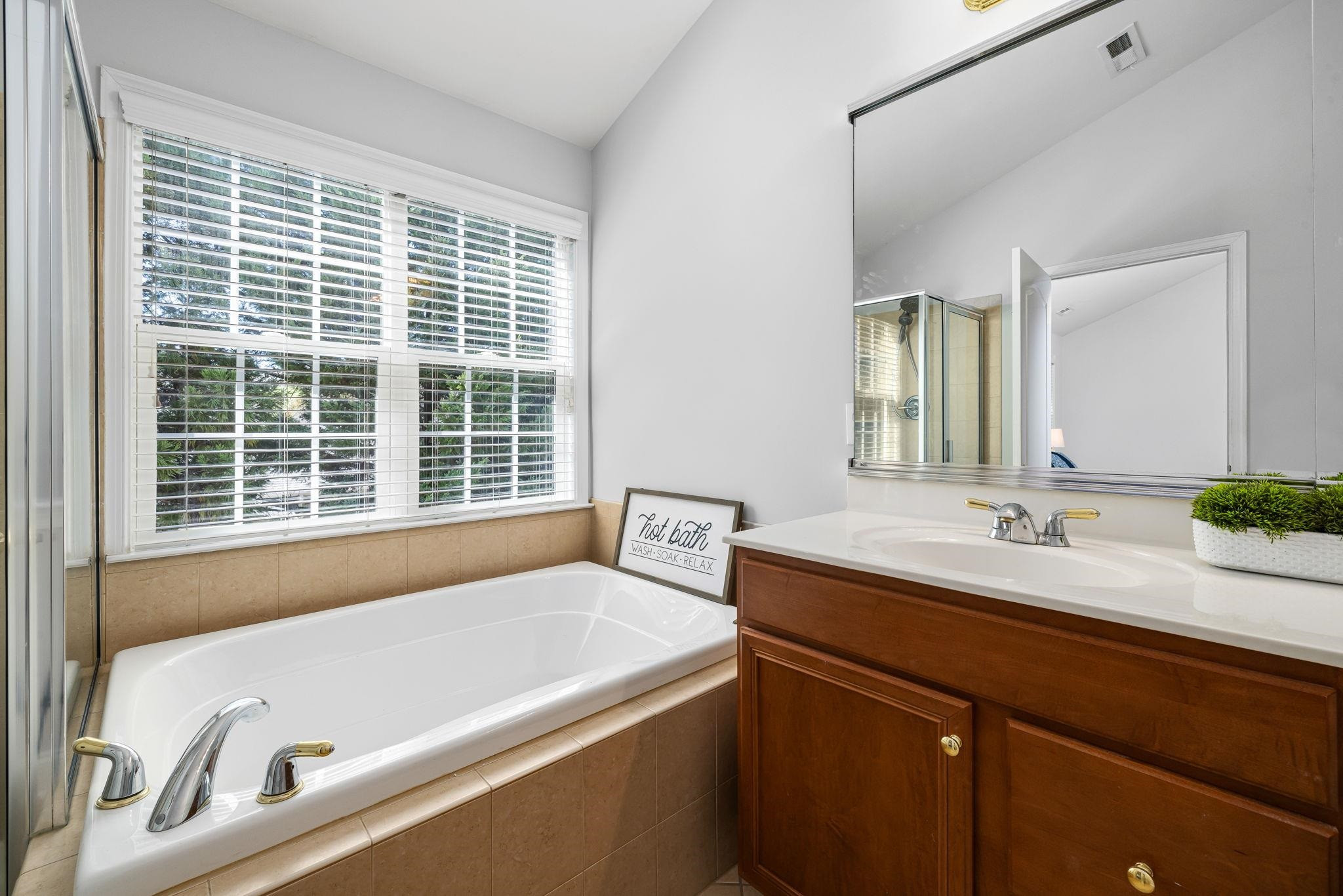 9510 Lost Key Court Raleigh, NC 27617 - Photo 35 of 46 a bathroom with a bathtub and a sink