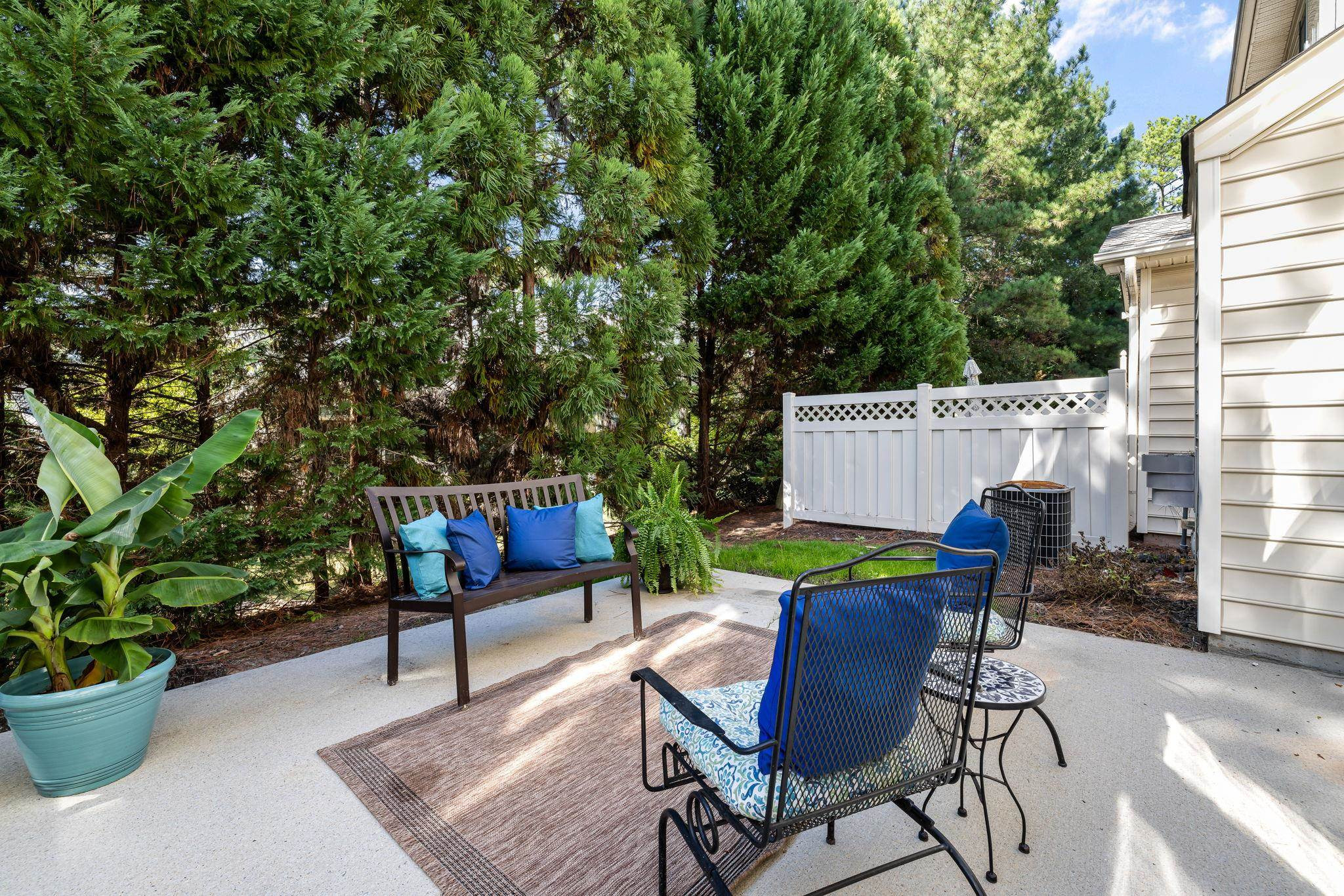 9510 Lost Key Court Raleigh, NC 27617 - Photo 39 of 46 a view of a chairs and tables in the back yard of the house